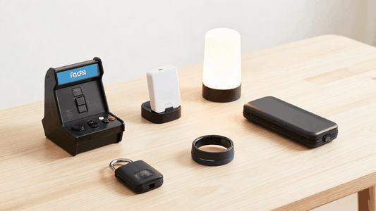 Gift gadget set for Gifts for Dad, featuring a black retro arcade console, charger, ring, and compact black accessories.