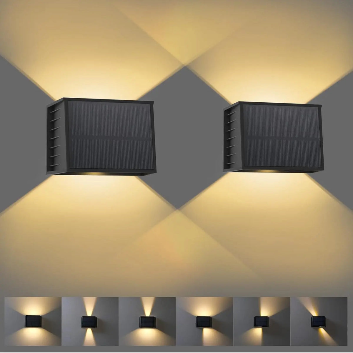 Two solar wall lights emitting a warm glow on a gray background.