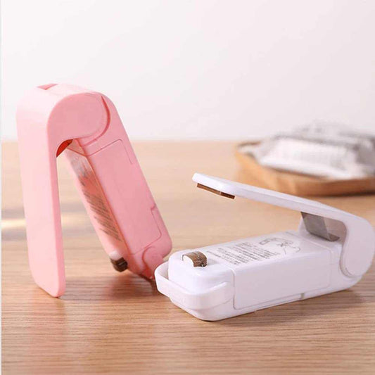 Mini Heat Sealer with a compact handheld design, featuring a pink sealer beside a white model with a flip-up lever.