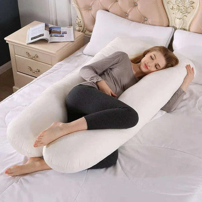 Sleep Therapy Pillow in white fabric, with a long, plush body pillow shape supporting the sleeper’s head and legs.