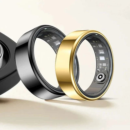 Smart Fitness Ring in polished gold-tone metal, with a smooth wide band and visible inner sensors; black ring also shown.